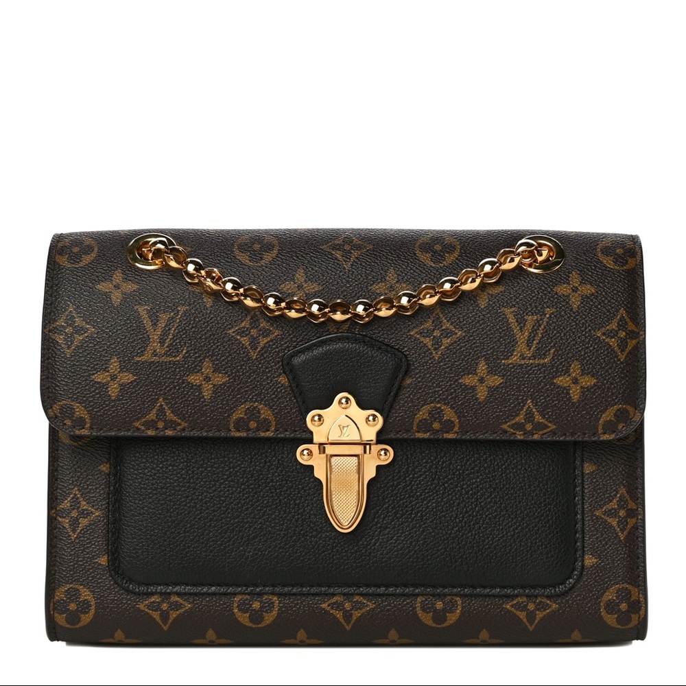 An authentic Louis Vuitton Monogram Victoire  shoulder bag in Black.